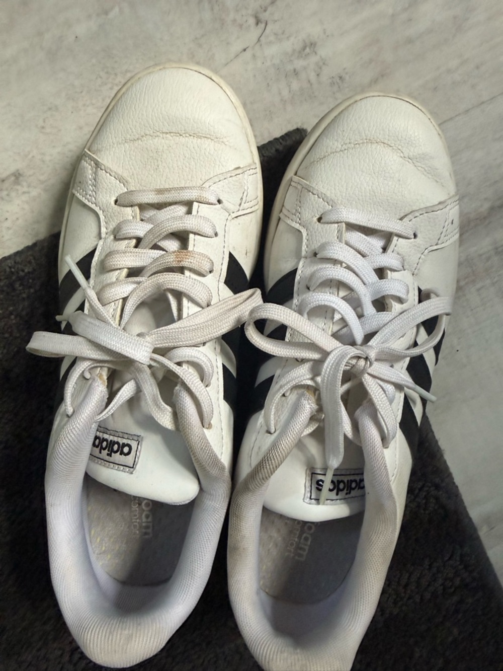 Worn adidas White Sneakers with Black Stripes